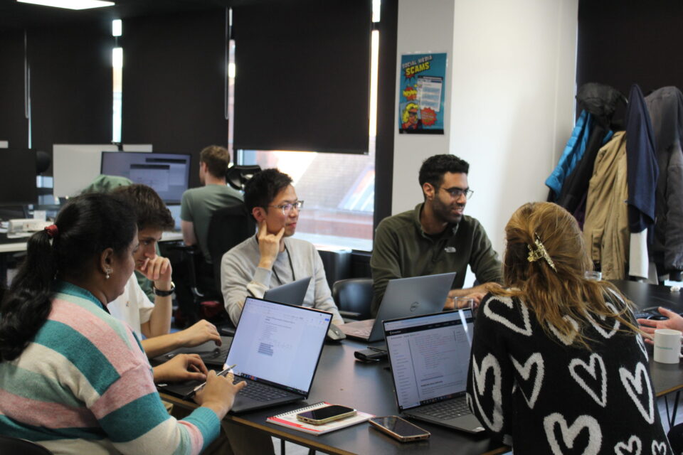 A group of employees collaborating at a table