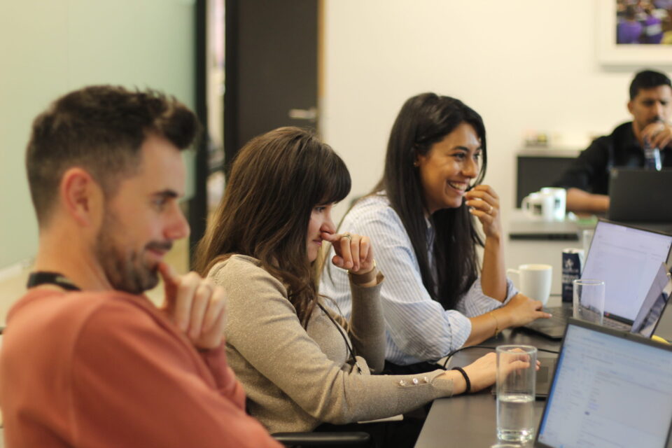 A group of employee smiling